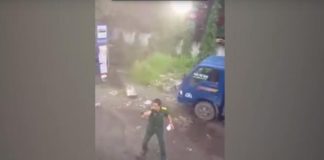 Hinh một sĩ quan quân đội rút súng dọa bắn tài xế ở khu công nghiệp Sóng Thần (Bình Dương)